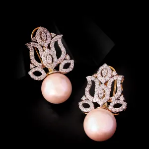 Earrings in fresh water pearls and Zircons