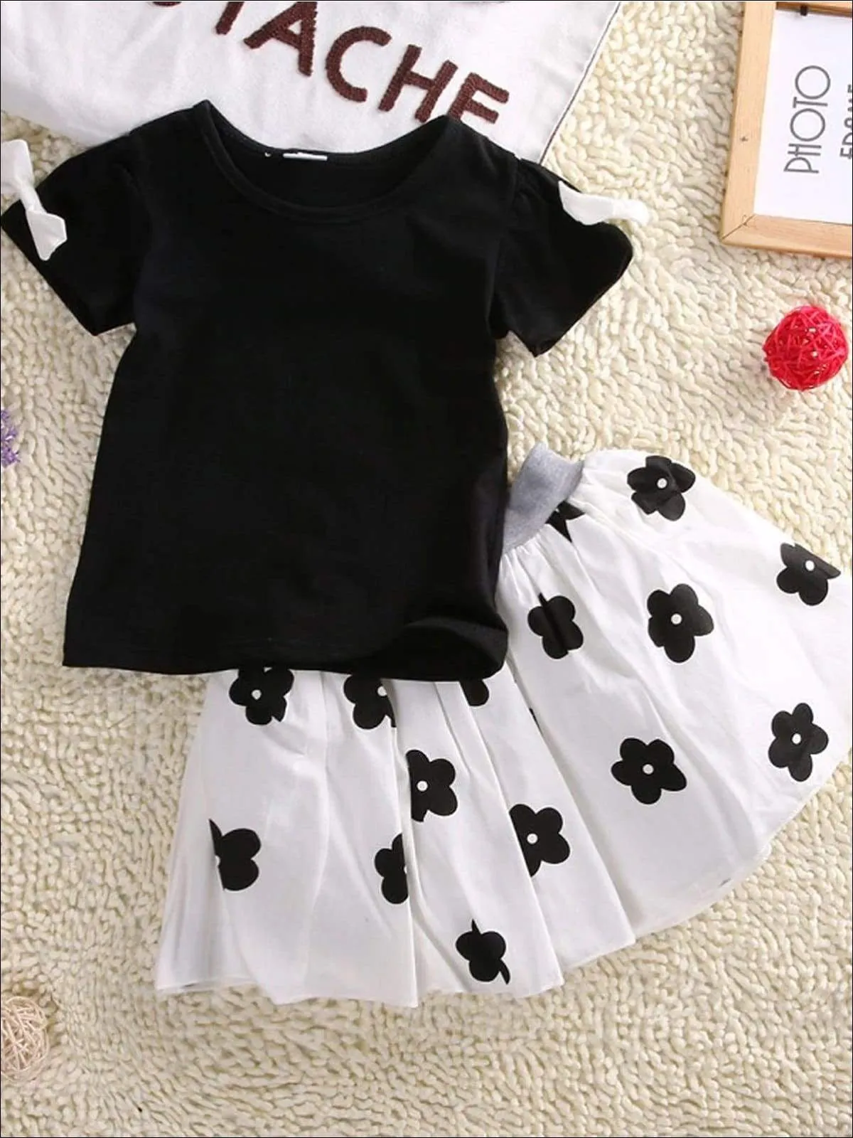 Girls Black Short Sleeve Blouse With White Bow Applique & White Skirt With Black Floral Print