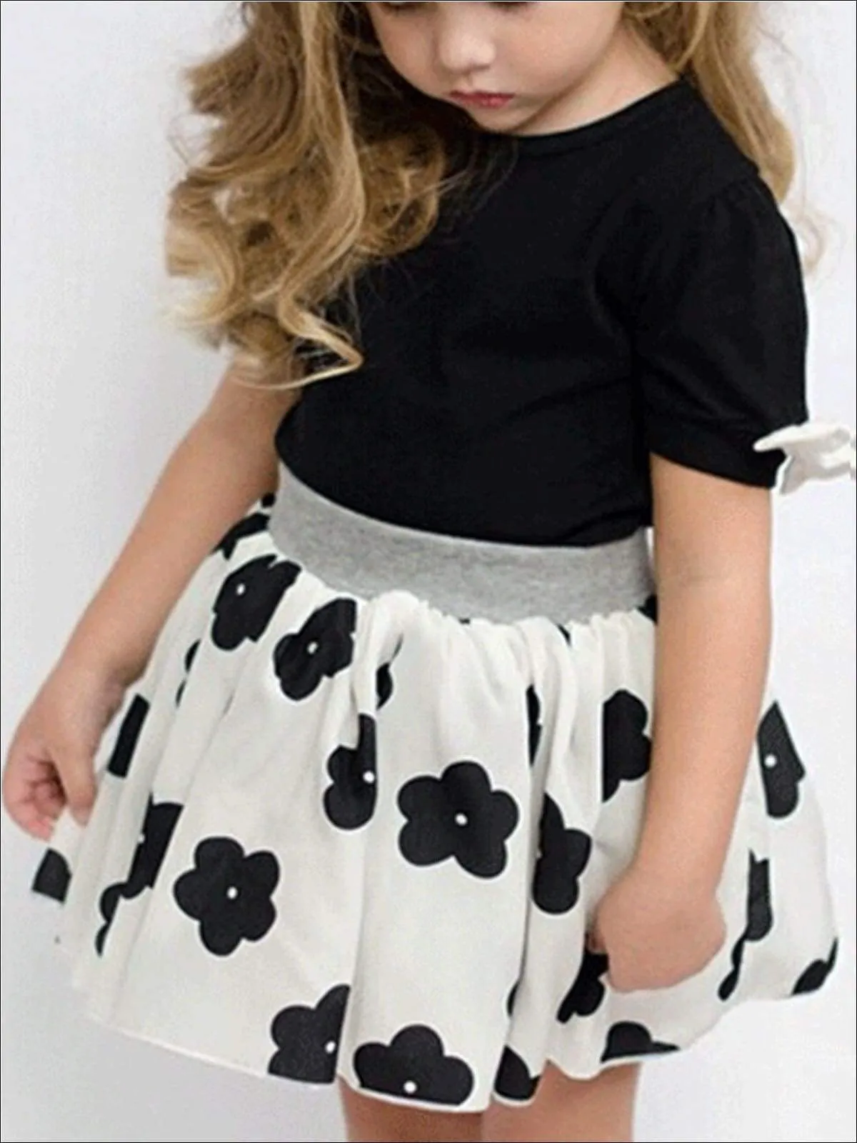 Girls Black Short Sleeve Blouse With White Bow Applique & White Skirt With Black Floral Print